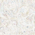 Detail of fabric in a playful abstract sun print in brown and blue on a white field.