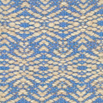 Flatwoven rug with a raised geometric linear design in cream on a bright blue field.