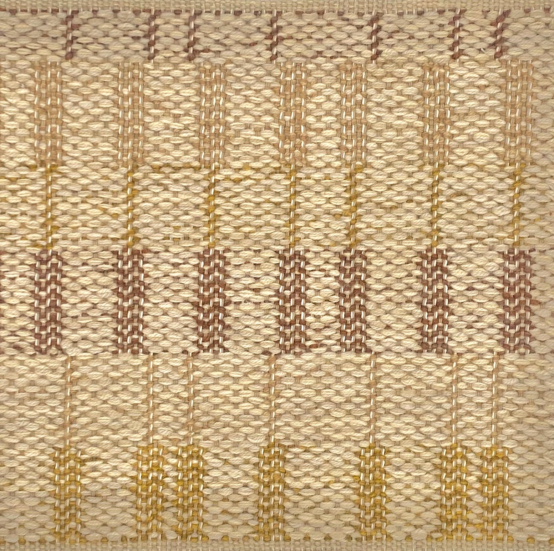 Flatweave rug in a stacked stripe design in ochre, brown and taupe. 