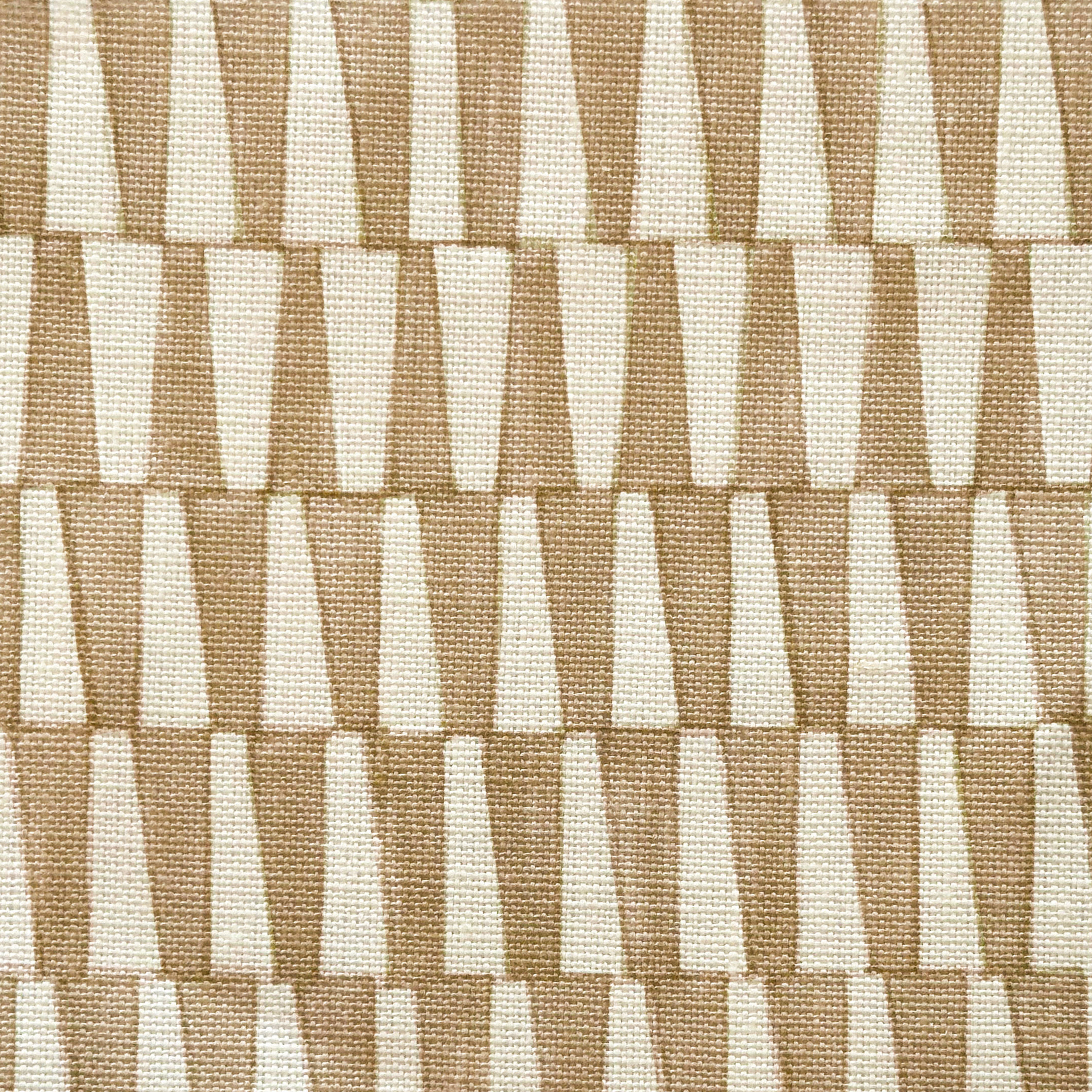 Close-up of fabric in a playful triangular stripe print in tan and light brown.