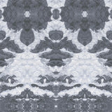 Detail of wallpaper in a painterly ikat print in shades of gray and light blue.