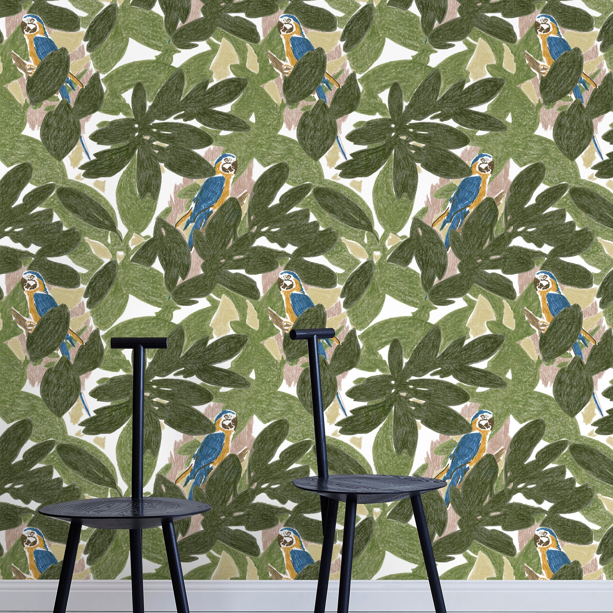 Two minimalist black chairs stand in front of a wall papered in a botanical and parrot print in green, blue and yellow.