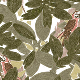 Detail of fabric in a playful botanical and parrot print in shades of green, brown and pink on a white field.