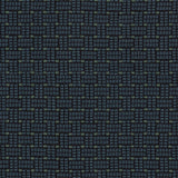 Embroidered fabric in a dashed basketweave design in navy blue with green accents.