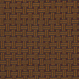 Embroidered fabric in a dashed basketweave design in caramel brown with red accents.