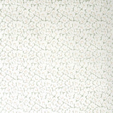 Wallpaper in a minimal floral print in rust and light green on a cream field.