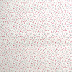 Wallpaper in a minimal floral print in navy and pink on a cream field.