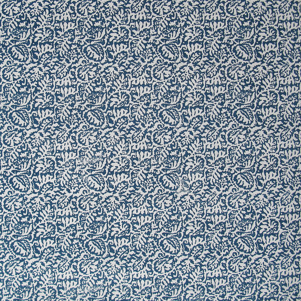 Detail of wallpaper in a dense paisley print in white on a navy field.