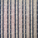 Detail of wallpaper in a dense tribal stripe pattern in shades of cream, navy and brown.