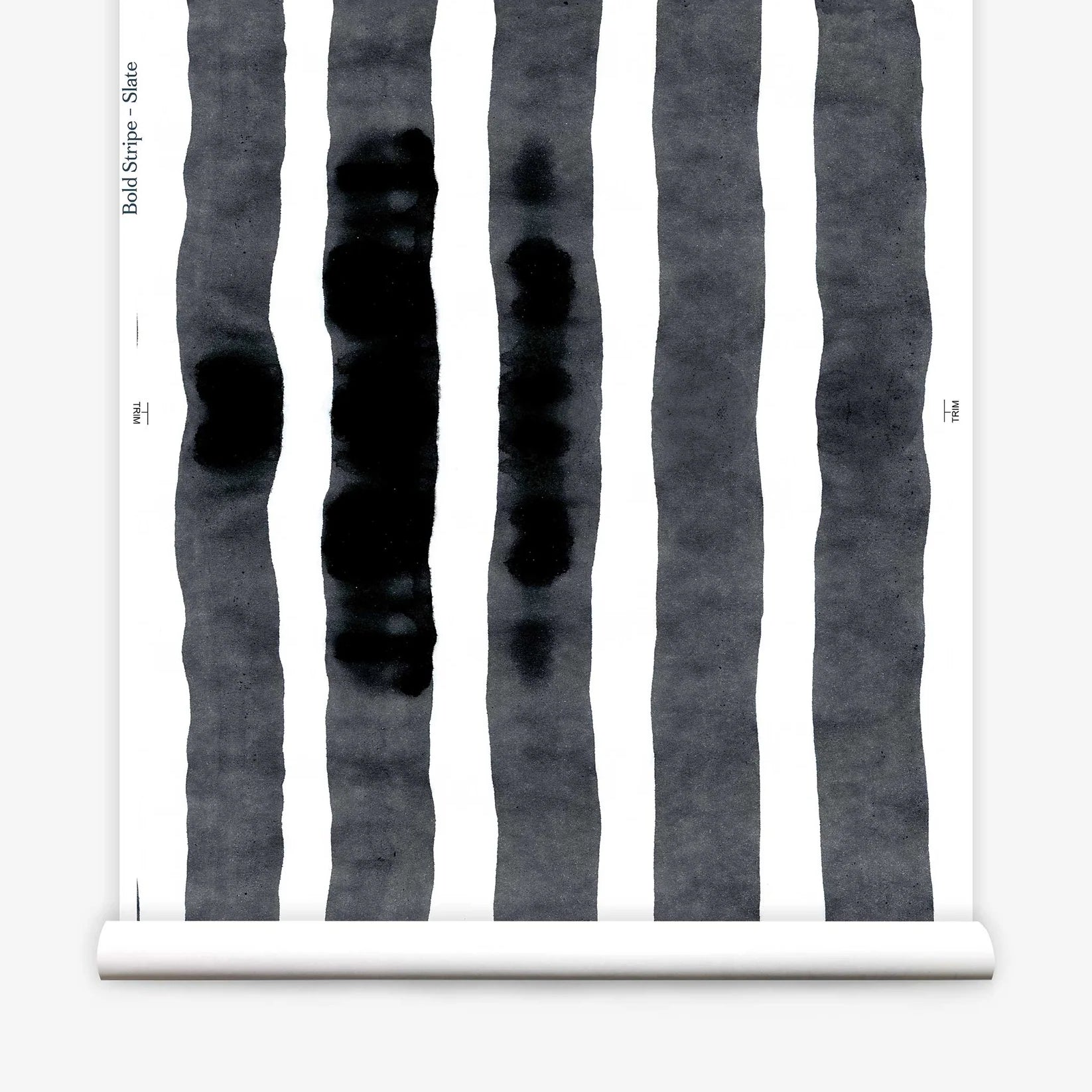 Wallpaper roll  with bold watercolor stripes in black and white on a white background. 