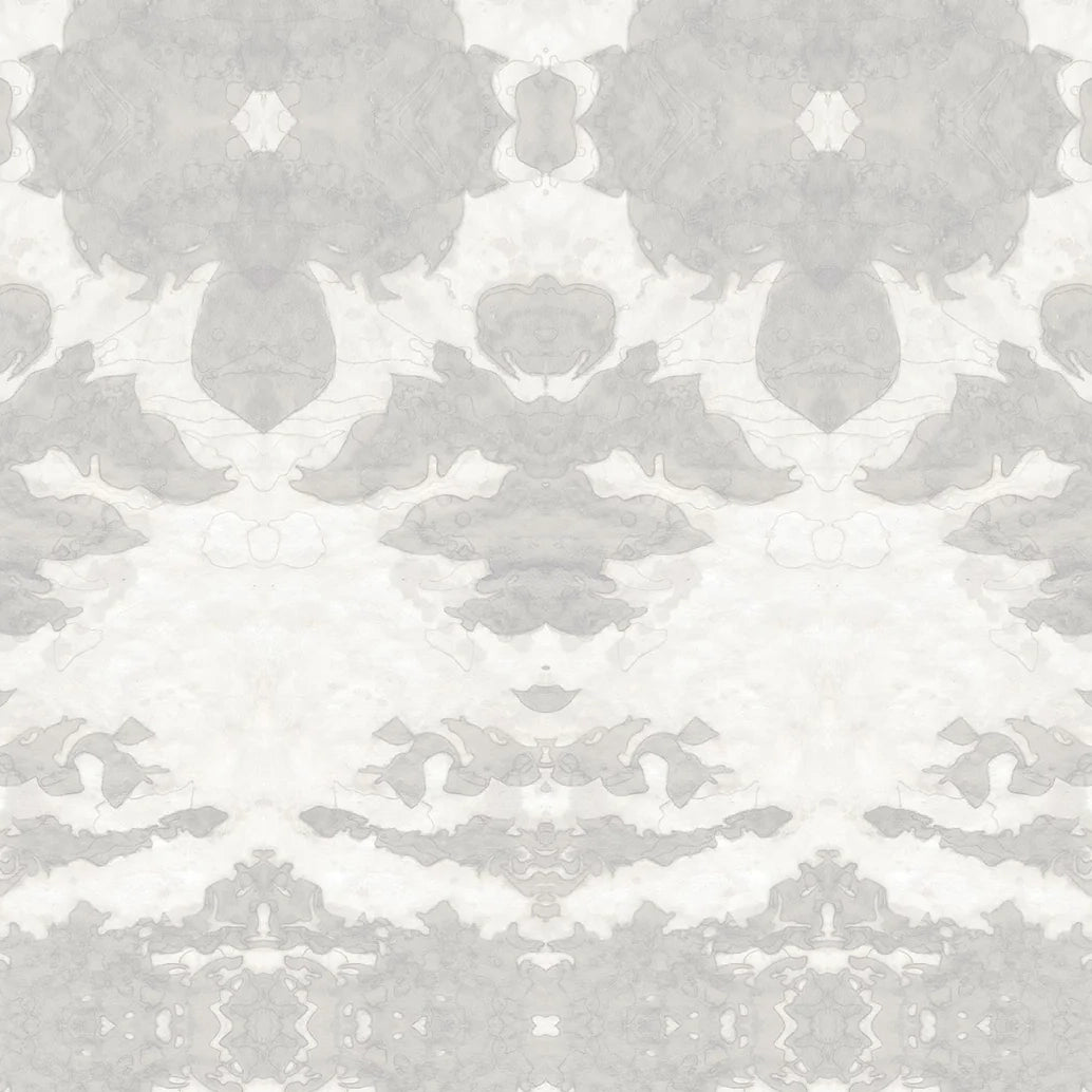 Detail of wallpaper in a painterly ikat print in shades of gray and cream.