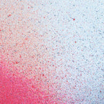 Close up of paint splatters in red and blue.