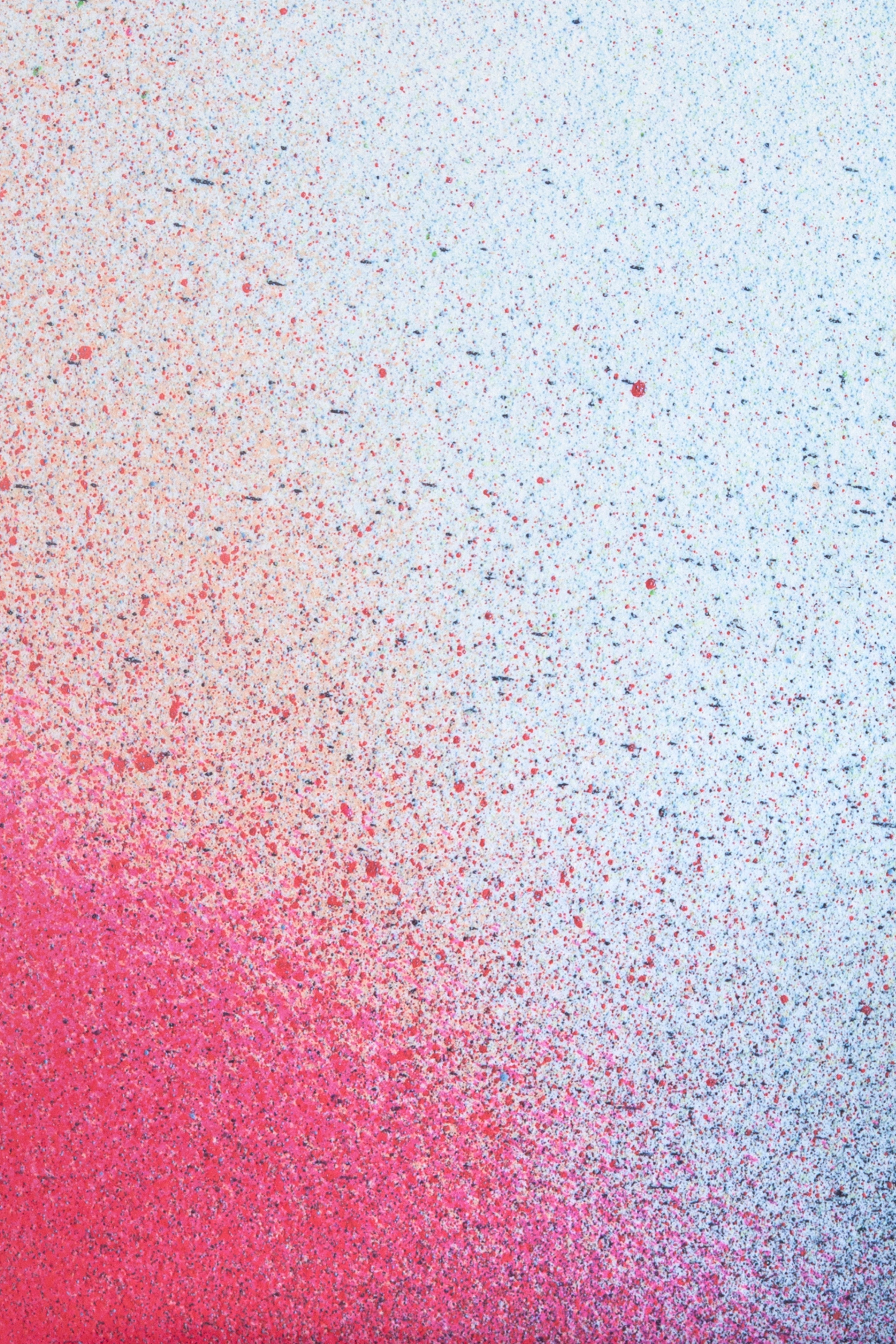 Close up of paint splatters in red and blue.