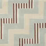 Close-up of fabric in a playful zigzag stripe print in shades of beige, blue and brown.