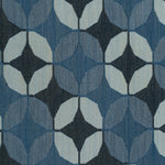 Detail of Alhambra Rug featuring a pattern of linked circles that create a star like lattice in a range of blue shades, from pale blue to chambray, indigo, to dark navy