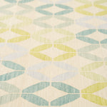 Detail of Alhambra Rug in Mint featuring a pattern of linked circles that create a star like lattice in a range of pastel turquoise, mint, yellow and lime green on a soft beige field. 