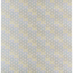 Detail of Alhambra Rug in Mint featuring a pattern of linked circles that create a star like lattice in a range of pastel turquoise, mint, yellow and lime green on a soft beige field. 