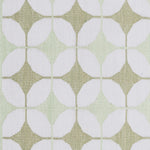 Detail of Alhambra Rug in Olive featuring pattern of linked circles that create a star like lattice in a soft olive and lime green on an ivory field. 