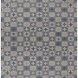 Full size Alhambra Rug in Seafret featuring pattern of linked circles that create a star like lattice in a range of pale blues, with a light green accent on a soft white field. 