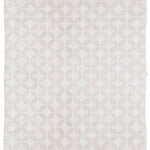 Full size Alhambra Rug in Stonewash featuring pattern of linked circles that create a star like lattice in a range of pale pink tones a soft white field. 