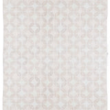 Full size Alhambra Rug in Stonewash featuring pattern of linked circles that create a star like lattice in a range of pale pink tones a soft white field. 