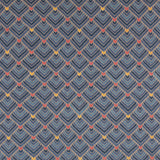 The Arrow Rug in Indigo-Coral features a dense pattern of nesting arrow shapes in shades of blue with accents of coral and yellow on a light brown field