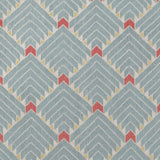 The Arrow Rug in Powder Blue-Coral features a dense pattern of nesting arrow shapes in soft blue with accents of coral and yellow on an ivory field. 