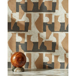 A sphere with marble base in front of a wall with a pattern of brown geometric vessel shapes over a white background with charcoal grey horizontal stripes.
