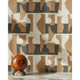 A sphere with marble base in front of a wall with a pattern of brown geometric vessel shapes over a white background with charcoal grey horizontal stripes.