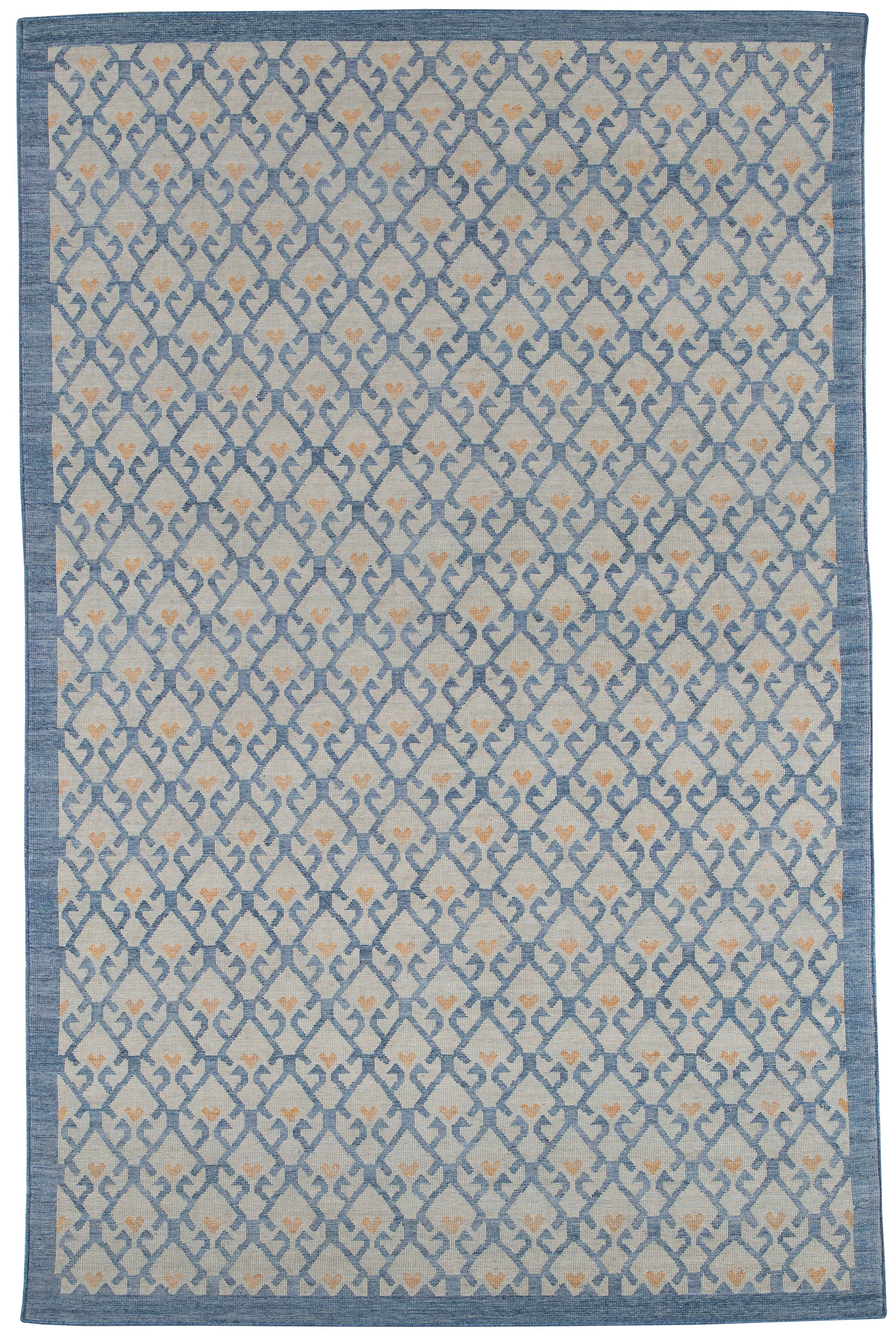 Full size Avesta Rug in Blue, a blue lattice pattern on a beige field with small orange heart accents. 