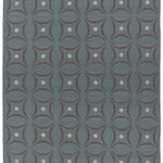 Full size Boe rug in Argento, featuring a pattern of curved segments in grey with white circles on a blue field. 