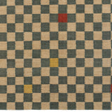 Detail of the Checkerboard Rug in bishop, a blue and white checkered pattern with random accents of red and yellow. 