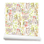 Partially unrolled wallpaper with a pattern of repeating watercolor illustrations of horses, farmers and country houses in green and pink on a white background.