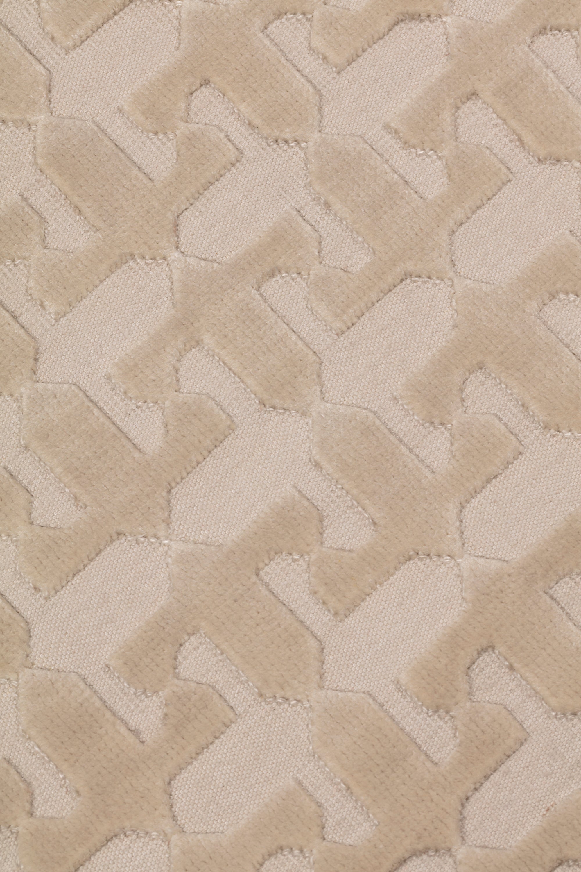 Detail of the Iseo Rug in Pearl, a textural monochromatic abstract geometric pattern in ivory. 