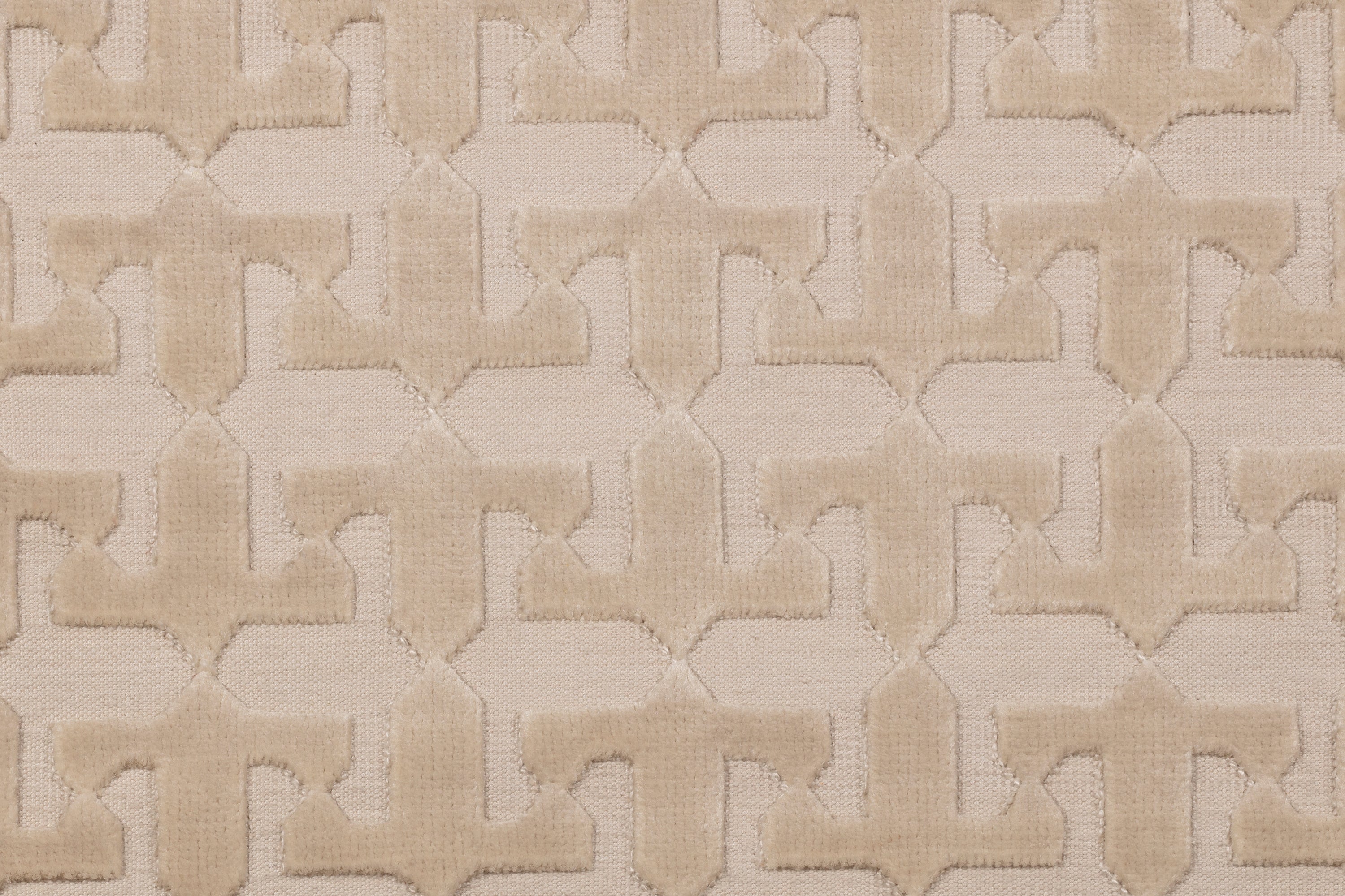 Detail of the Iseo Rug in Pearl, a textural monochromatic abstract geometric pattern in ivory. 