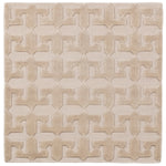 Detail of the Iseo Rug in Pearl, a textural monochromatic abstract geometric pattern in ivory. 