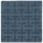 Detail of the Rug in Stormy Sky, a textural monochromatic abstract geometric pattern in blue. 