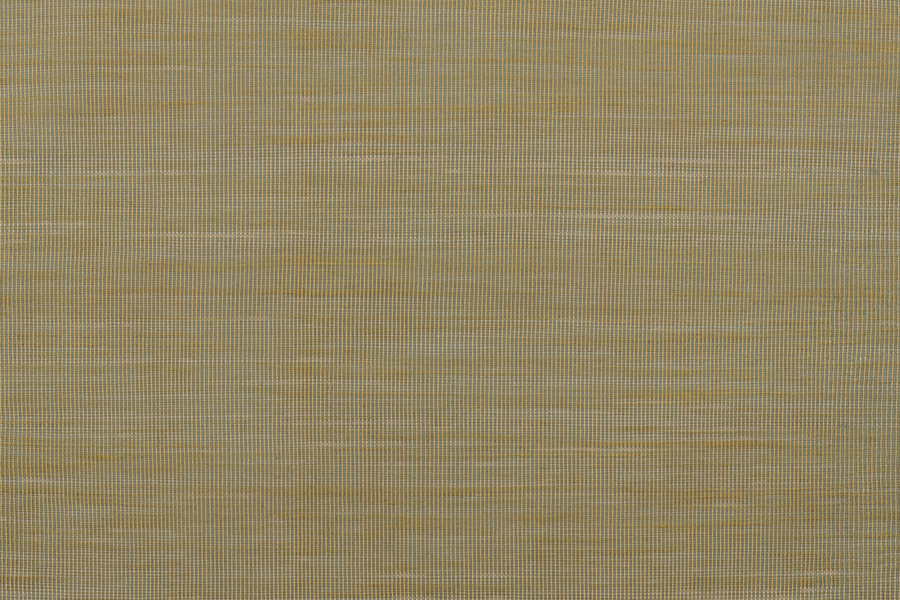 Detail of of the Moire Rug in Artemesia, a subtle striated pattern in lime green. 