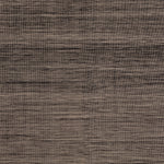 Detail of the Moire Rug in Rockpool, a subtle striated pattern tan and black. 