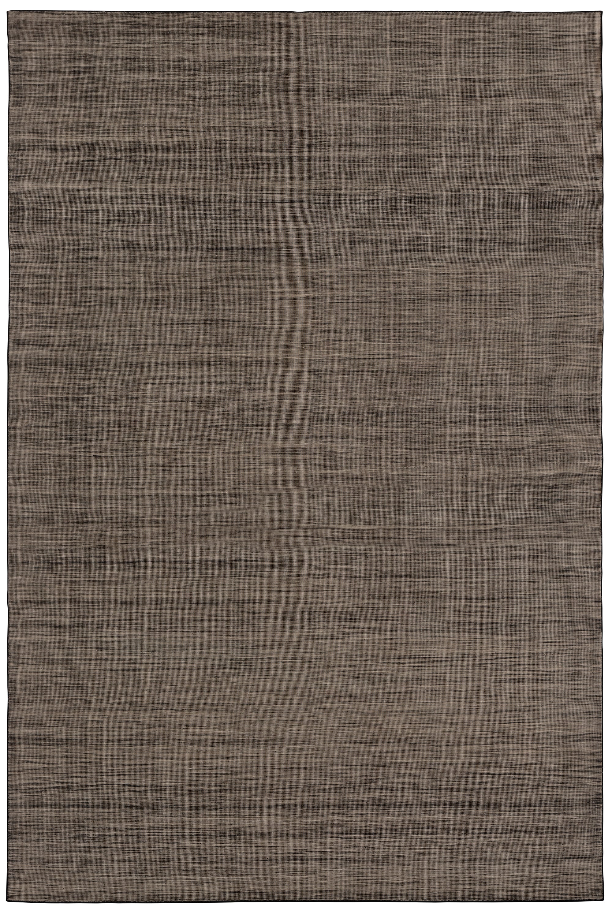 Moire Rug in Rockpool, a subtle striated pattern tan and black. 