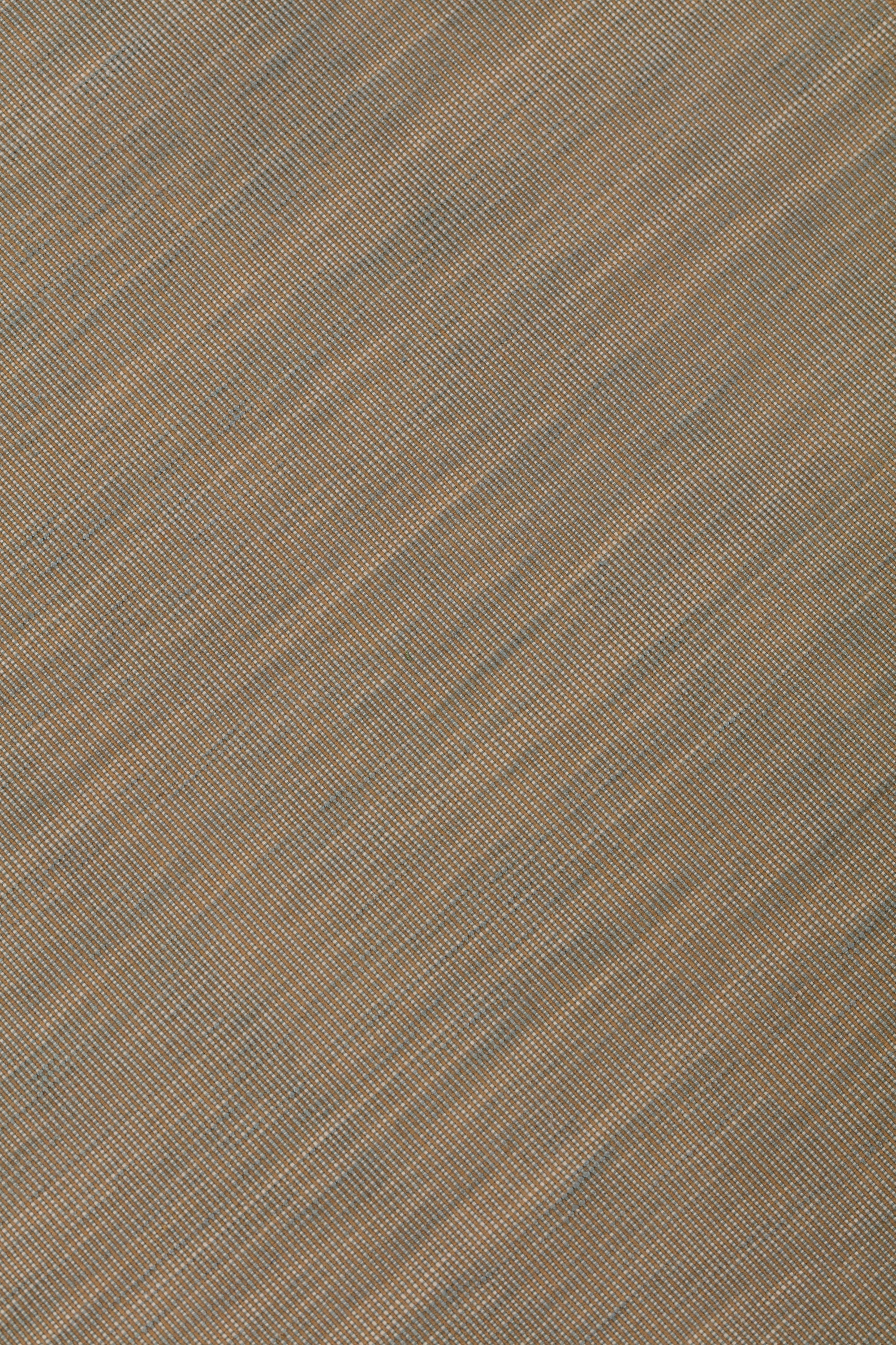 Detail of the Moire Rug in Sand-Pebble, a subtle striated pattern in warm taupe. 
