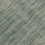 Detail of the Moire Rug in Sea Breeze, a subtle striated pattern in teal and off white. 