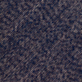 Detail of the Penta Rug in Tempestl, a subtle striated pattern in indigo blue and taupe. 