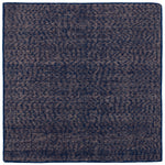 Detail of the Penta Rug in Tempestl, a subtle striated pattern in indigo blue and taupe. 