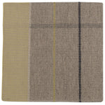 Detail of the Jasper Waffle Rug in Peridot, a large scale plaid pattern of ecru, yellow, grey and off white. 