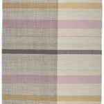 Jasper Waffle Rug in Red Fossile, widely spaced stripes of yellow, pink, red, white and black on a split light grey fand ivory field. 