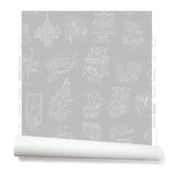 Partially unrolled wallpaper with white hand-drawn illustrations of New York City landmarks on a gray background.