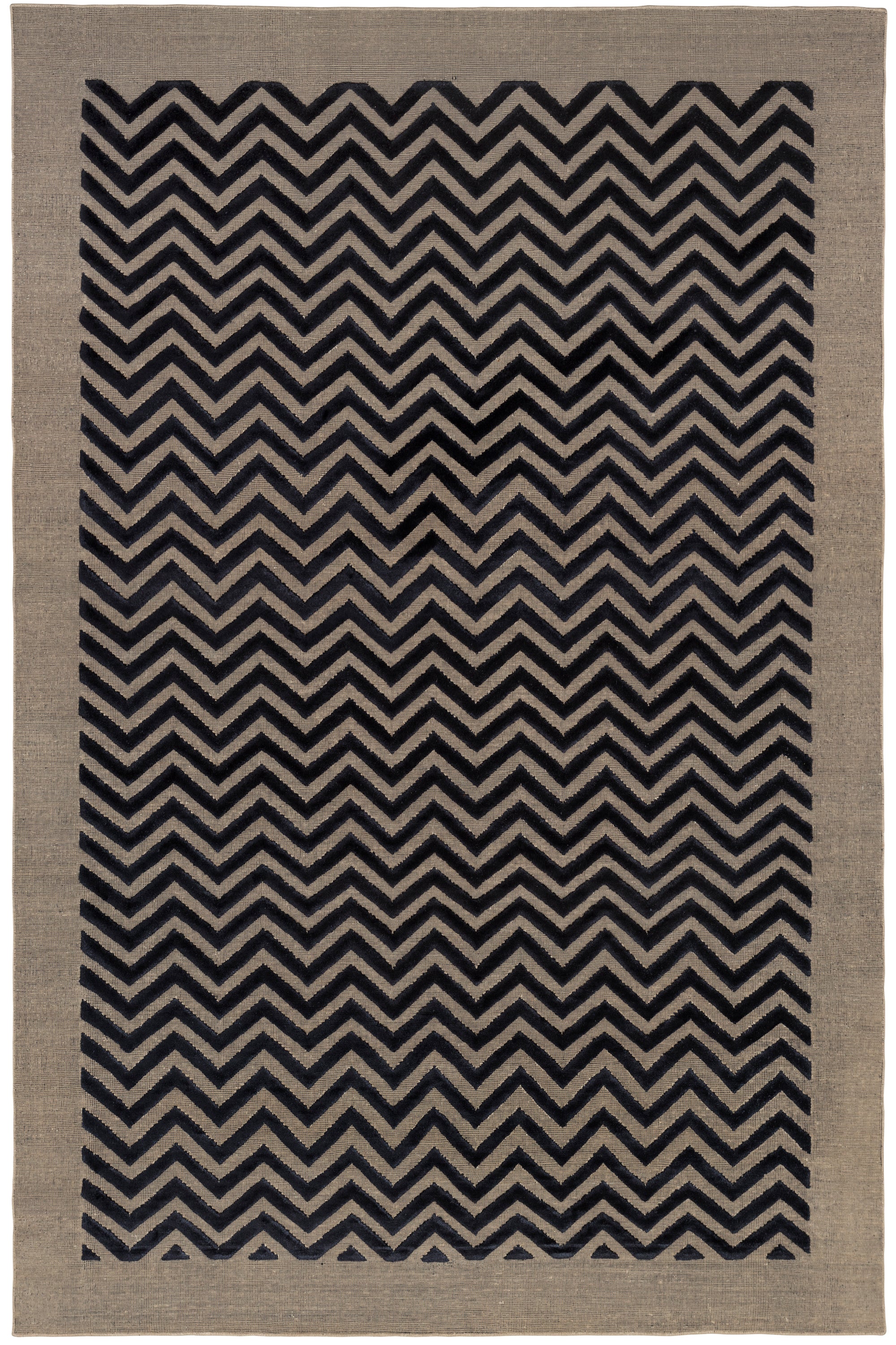 Full size Penta Chevron Rug in Jet, a black chevron pattern on a taupe field with a wide solid border. 