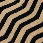Deatil of the Penta Chevron Rug in Onyx-Ivory a black and white chevron pattern. 