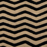 Deatil of the Penta Chevron Rug in Onyx-Ivory a black and white chevron pattern. 